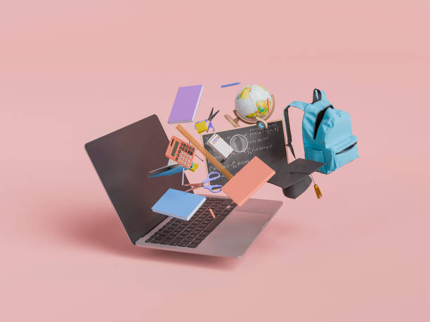 istock Laptop with Floating School Supplies on Red Background 2162510117