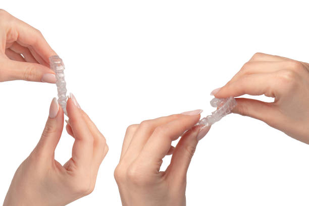 istock Transparent mouth guard in a woman's hand isolated. 2162510598