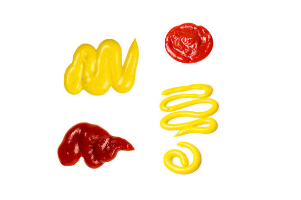 istock Ketchup and yellow sauce splashes isolated on white background 2162510606