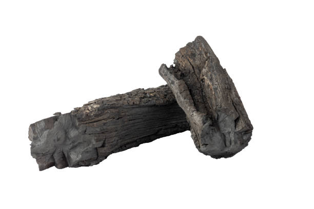 Stack of charcoal logs isolated on white background.