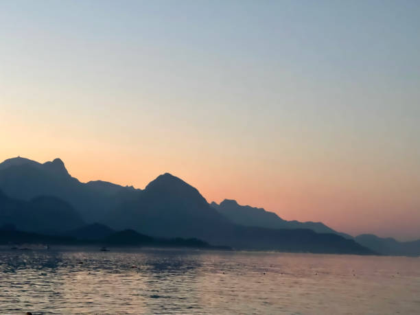 istock sunset on the sea and mountains 2162511615