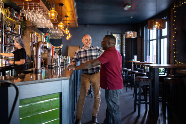 istock Friends Sharing Stories in a Bar 2162511633
