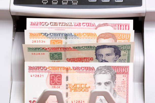 istock Cuban Peso in the counting machine 2162512218
