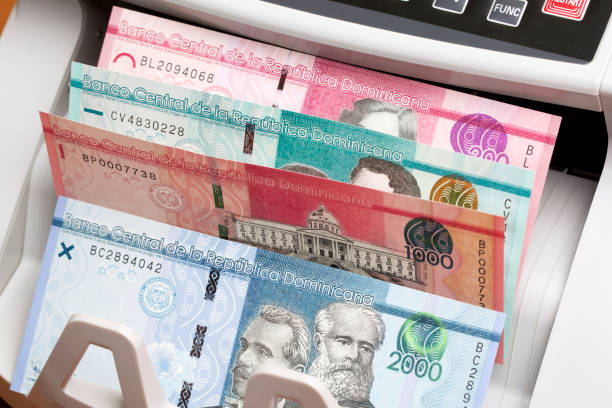 istock Dominican peso in the counting machine 2162512228