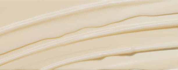 istock Beige cream texture, minimal cosmetic background, lotion smudged texture 3d rendering 2162514176