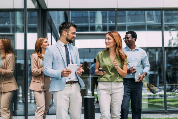 istock Business people using digital tablet outdoors. 2162514240