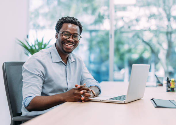 istock Successful businessman in modern office working on laptop. 2162514244