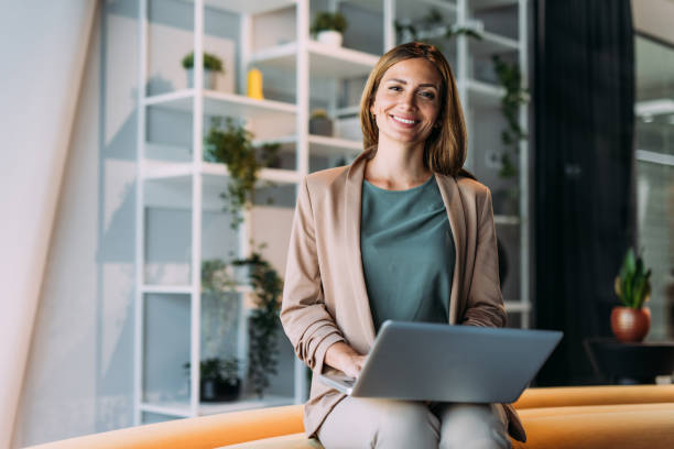 istock Successful businesswoman in modern office working on laptop. 2162514270