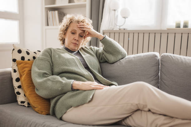 istock Pensive senior woman at home 2162515979