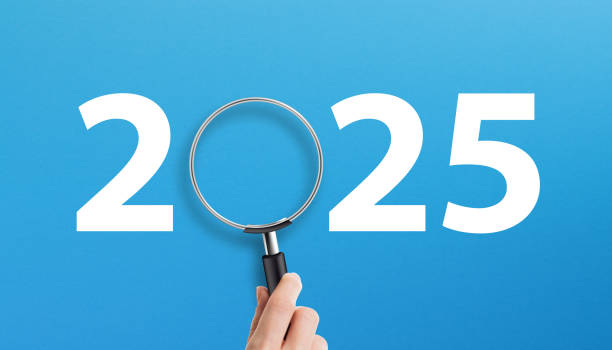 istock Happy New Year 2025 with magnifying glass on blue background 2162516360