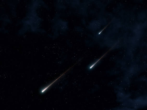 istock Shooting stars on a black background. Fireballs flashed in the sky. 2162518820