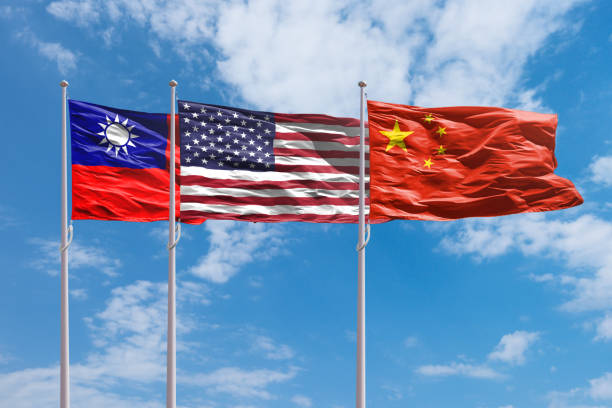 istock Taiwan, USA and China flags above blue sky 2162520127