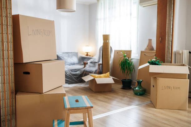 istock Living room packed in cardboard boxes for home moving 2162521209
