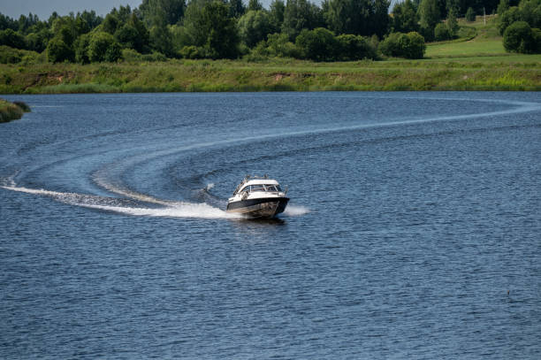 istock Motor boat goes fast on water. River landscape. 2162523080