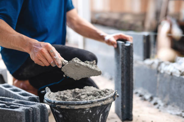 istock man is laying down and holding a trowel in his hand 2162533052