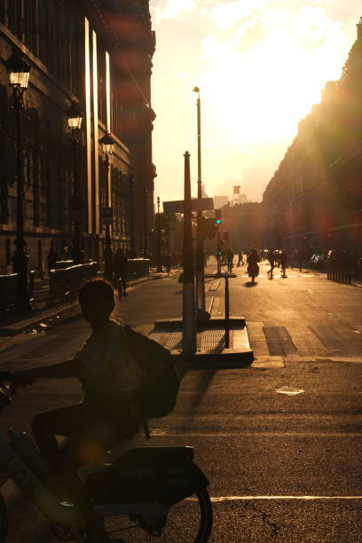 Paris, France - July 15, 2024. A nice sunset during the golden hour on the empty Rivoli Street.