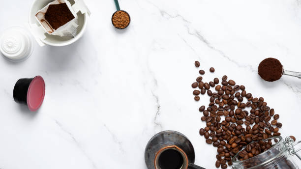istock Ingredients for making coffee. Different ways to make coffee metal cezve, coffee machine capsules, drip. Coffee making concept. Flat Lay. Top view. Copy space 2162535470