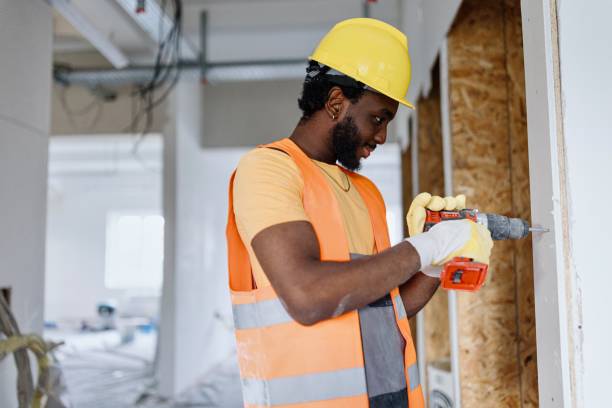 istock Close-up of a construction worker intensely focused on drilling a hole 2162544019