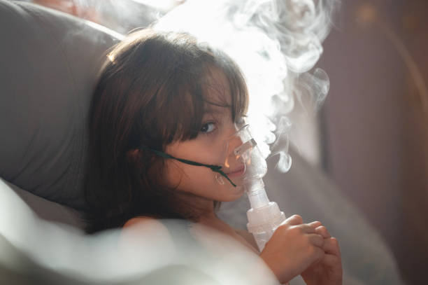 istock Child girl hold nebuliser 2162547365