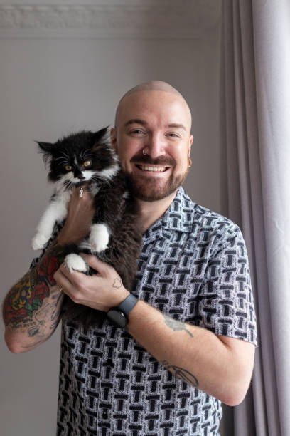 istock Man and his Kitten at Home 2162548737