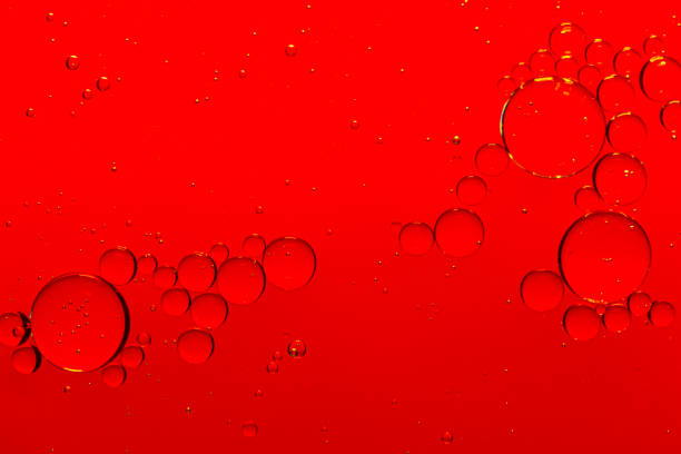 istock Macro red bubble texture close-up,red macro bubbles,Backgrounds, Abstract Backgrounds, Soda, Red, Carbonated,Beauty concept background. Closeup cosmetic liquid gel with bubbles on red colors background 2162551006