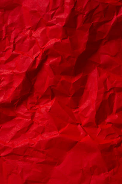 istock Wrinkled red paper texture,Rectangular crumpled sheet of red paper on a white isolated background 2162551011