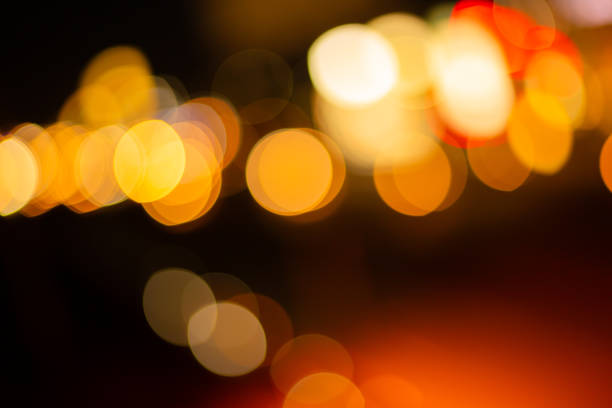 istock bokeh lights background,Red glitter vintage lights background. defocused. 2162551044