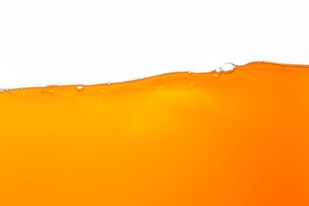 istock Orange juice texture isolated white background,Close up bright orange juice texture for health and nature waves 2162552063