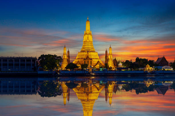 istock Wat Arun Ratchawararam Ratchawaramahawihan, Thailand,Wat Arun Ratchawararam Ratchawaramahawihan at sunset in bangkok Thailand. Landmark of Along the Chao Phraya River Thailand 2162552152