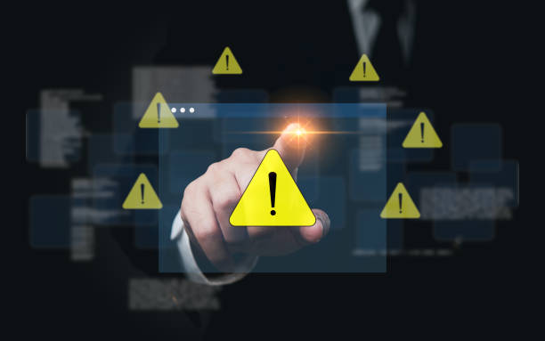 istock Businessman activating digital warning symbol. Highlight on cybersecurity risk. Perfect for security, tech, IT presentations. 2162558641