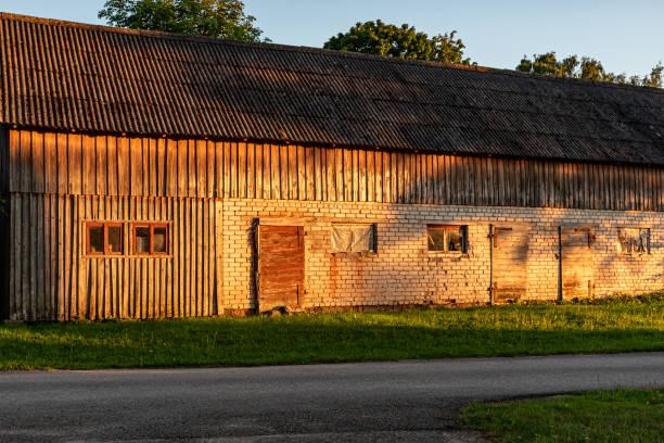istock view of an old barn in sunset light, old windows and doors in an ancient building, summer 2162561257