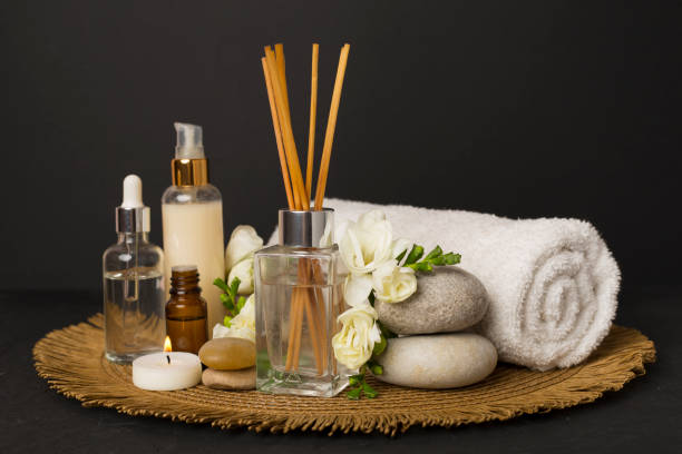 istock Spa composition with freesia flower and aroma diffuser on concrete background 2162561950