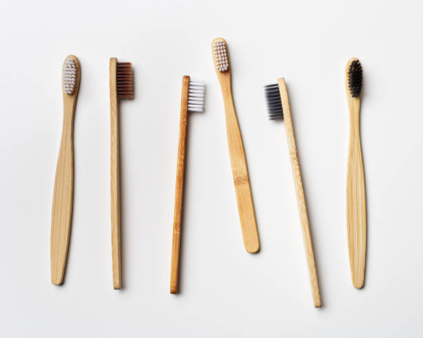 istock Assorted bamboo toothbrushes on white background, eco-friendly oral hygiene, tooth care, personal toothbrush for everyday use. Minimal aesthetic flat lay, top view Zero waste, organic product 2162562033