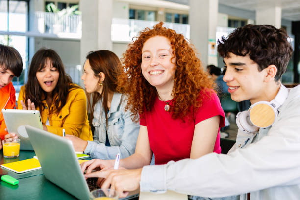 istock Happy young group of diverse students studying together and working together 2162562427