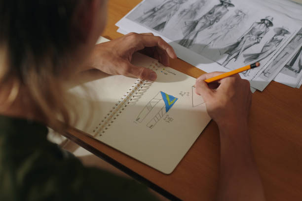 istock Designer Drawing Sketches In Album 2162562493