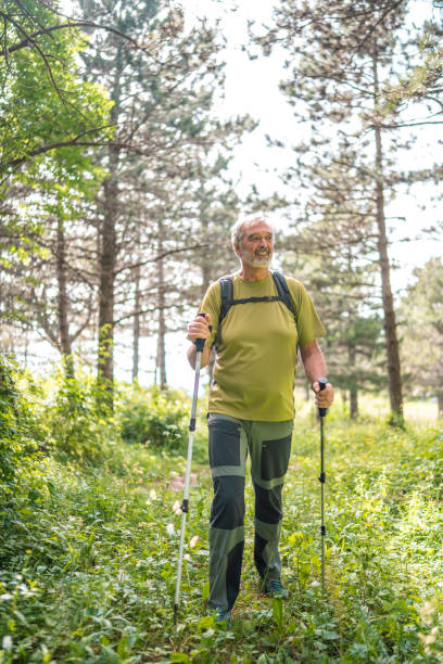 istock Senior Man Trekking in Lush Forest 2162572923