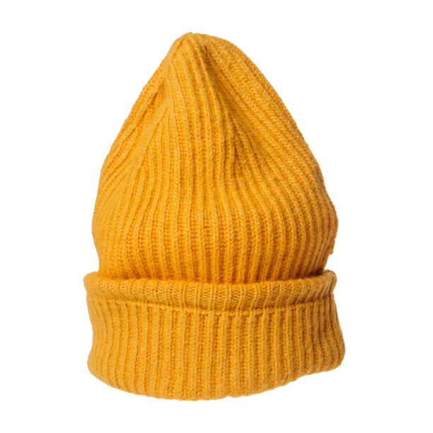 istock Bright orange knitted hat close-up. A warm and stylish accessory with an expressive texture, ideal for the cold 2162576598