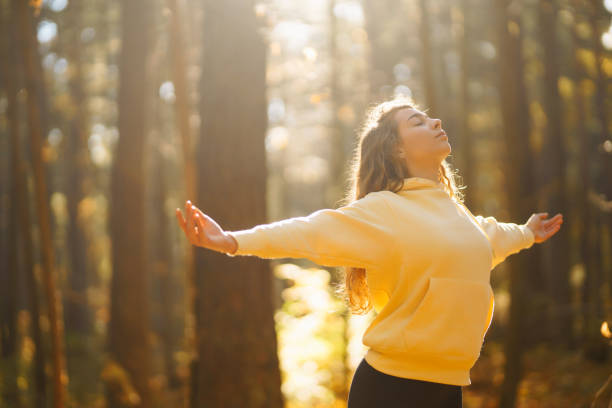 istock Young Woman doing yoga pose in peaceful natural forest. 2162576669