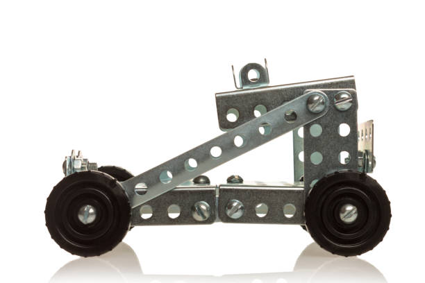 istock Metal Model Car Construction Set: A buildable metal model car with crisp angular shapes, perforated plates and visible fasteners. Realistic details and moving parts such as rotating wheels. 2162577732