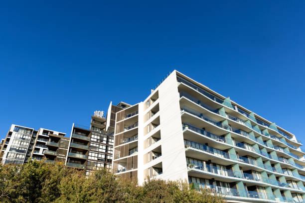 istock Suburb with modern apartment buildings, background with copy space 2162577772