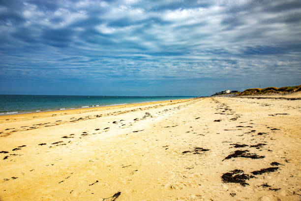 Shoreline beach view from Avalon Pier along the Alantic Coastline in Outer Banks, North Carolina, USA