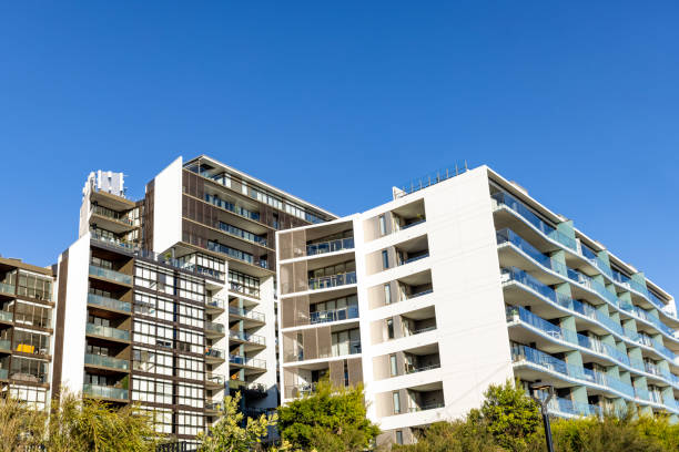 istock Suburb with modern apartment buildings, background with copy space 2162578316