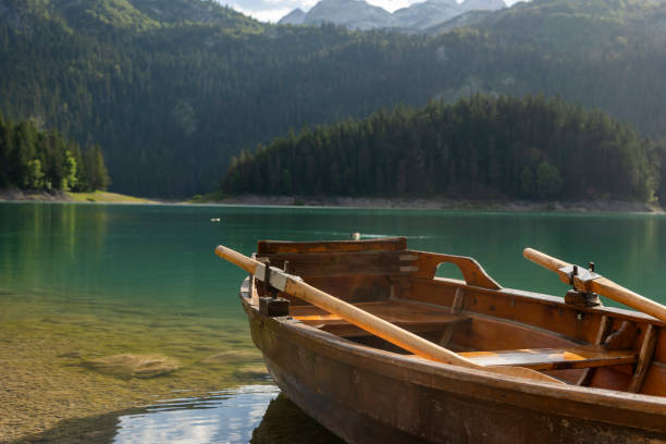 istock Wooden Rowboat on Tranquil Mountain Lake 2162578748