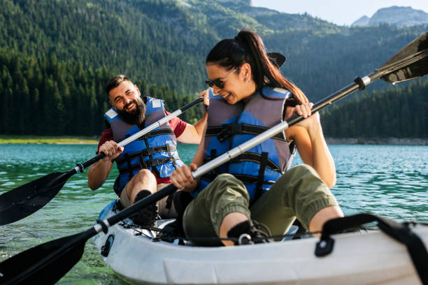 istock Couple Kayaking on Mountain Lake 2162578755