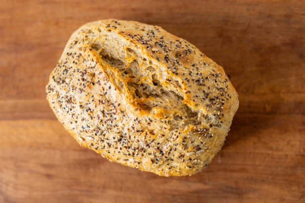 istock Handmade loaf of bread on a rustic wooden table 2162584634