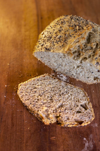 Handmade loaf of bread on a rustic wooden table