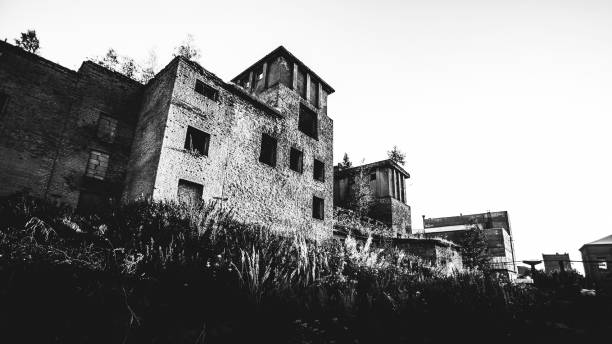 Damaged, destroyed building as a result of the war between Russia and Ukraine. Black and white photography