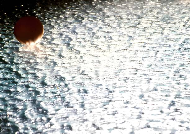 A ping-pong ball over a glass Studio Photo 2