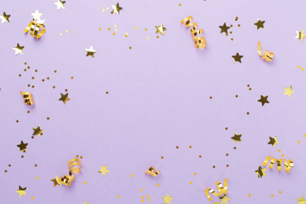 istock Golden confetti on color background, top view 2162588047