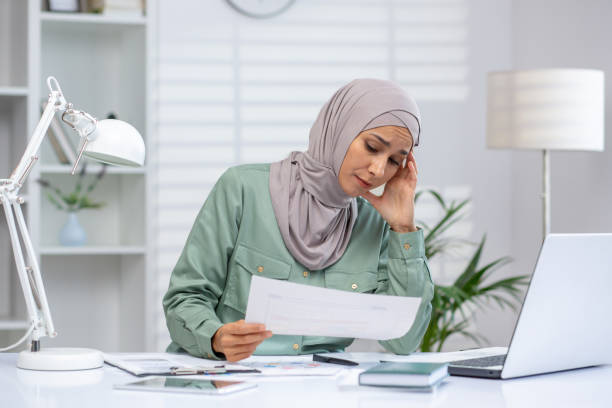 istock Stressed woman working at home office with laptop and documents 2162588913